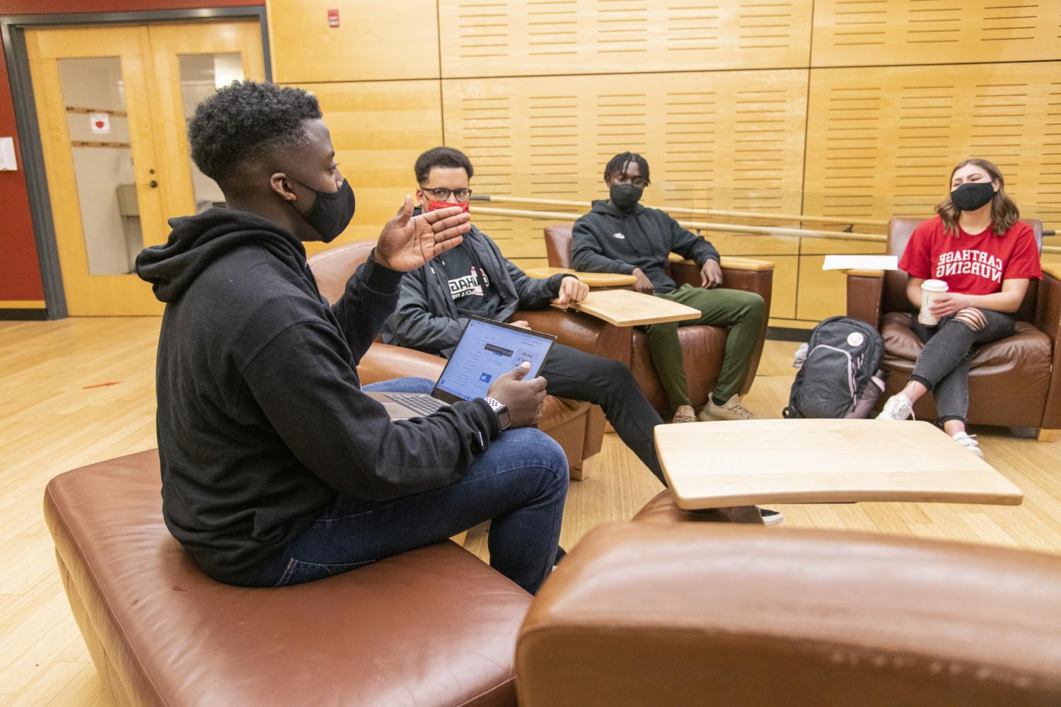 Students gather to work together on a group project in the A. W. Clausen Center for World Business.